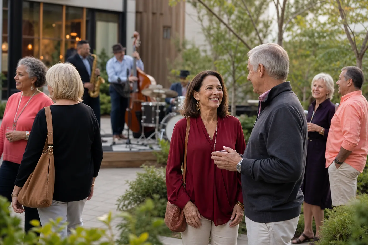 Singles over 50 talking at an outdoor community concert